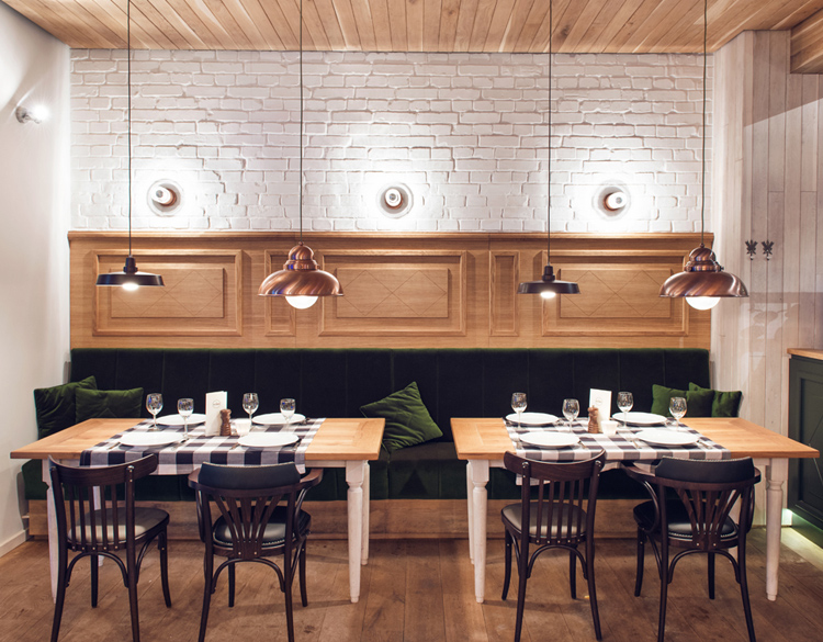 Althaus Restaurant by PB Studio and Filip Kozarski in Gdynia, Poland, via Yellowtrace. Althaus Restaurant, dining room, painted brick wall, green velvet upholstery, brass pendant lighting
