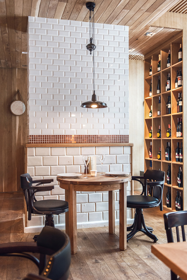 Althaus Restaurant by PB Studio and Filip Kozarski in Gdynia, Poland, via Yellowtrace. Althaus Restaurant, dining room, white tiles, wine rack, timber ceiling