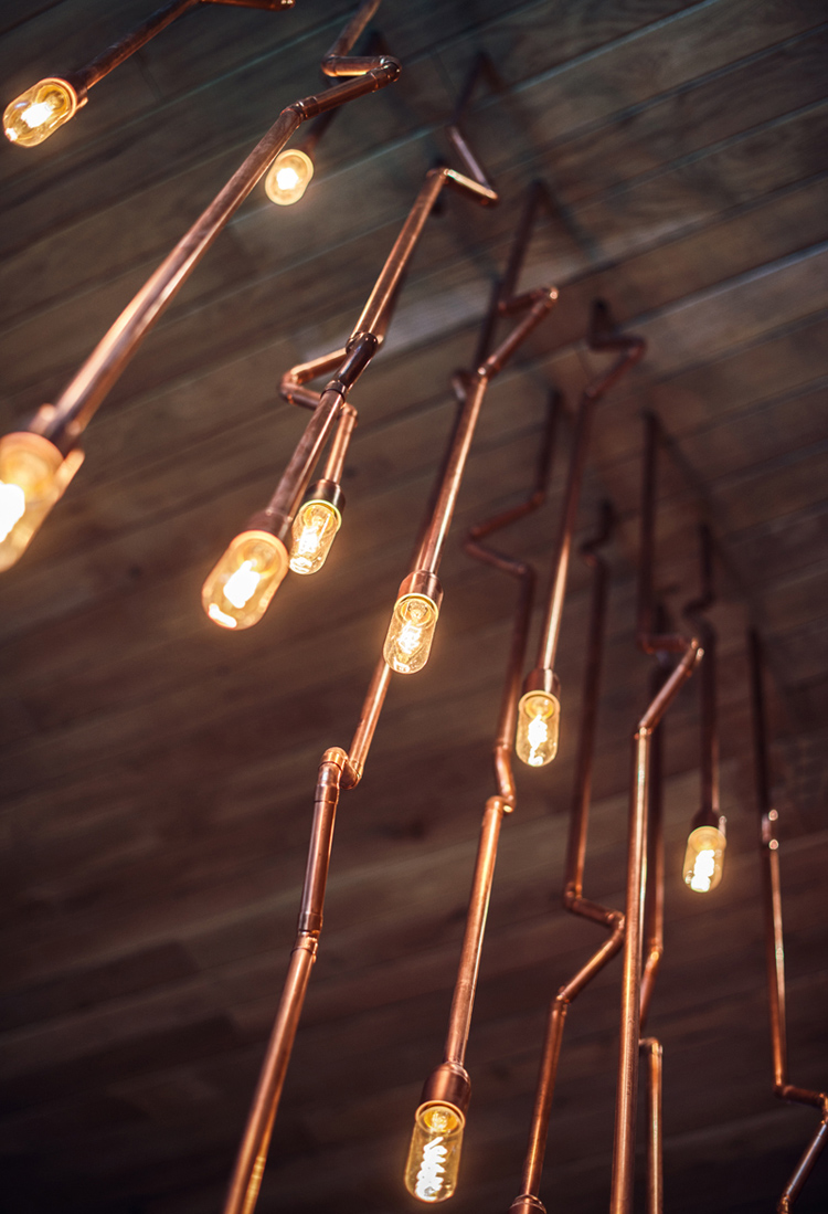 Althaus Restaurant by PB Studio and Filip Kozarski in Gdynia, Poland, via Yellowtrace. copper chandelier