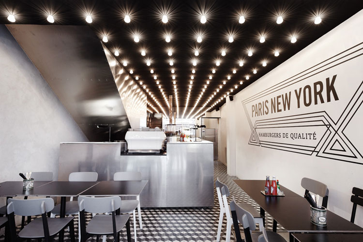Paris New York Burger Restaurant by CUT architectures in Paris, via Yellowtrace. PNY restaurant interior, wall graphic, black ceiling, light bulbs on grid