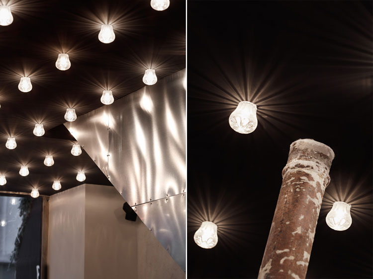 Paris New York Burger Restaurant by CUT architectures in Paris, via Yellowtrace. black ceiling and light bulb details