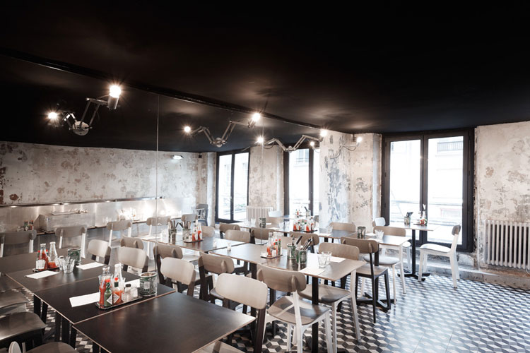 Paris New York Burger Restaurant by CUT architectures in Paris, via Yellowtrace. PNY restaurant cement floor tiles, distressed wall finish and large mirror wall