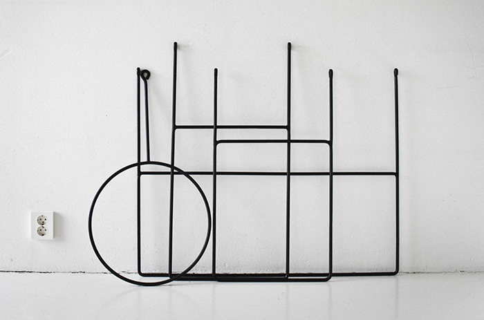 Suspended clothing rails by Annaleena Leino | Yellowtrace.