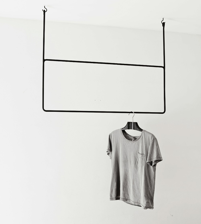Suspended clothing rails by Annaleena Leino | Yellowtrace.
